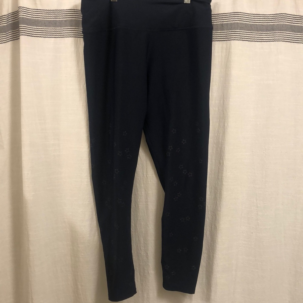 Soul cycle navy blue leggings with stars on them